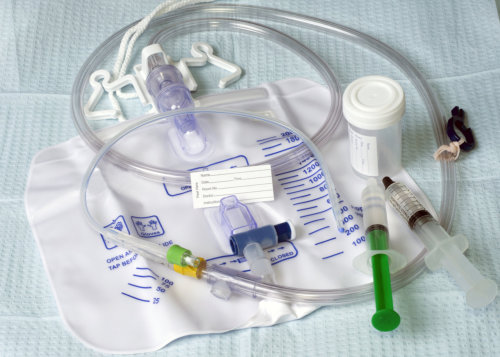 Foley catheter with drainage bag and patient name tag